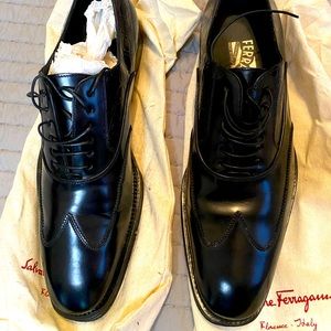 Ferragamo leather wingtip shoes with embossed logo